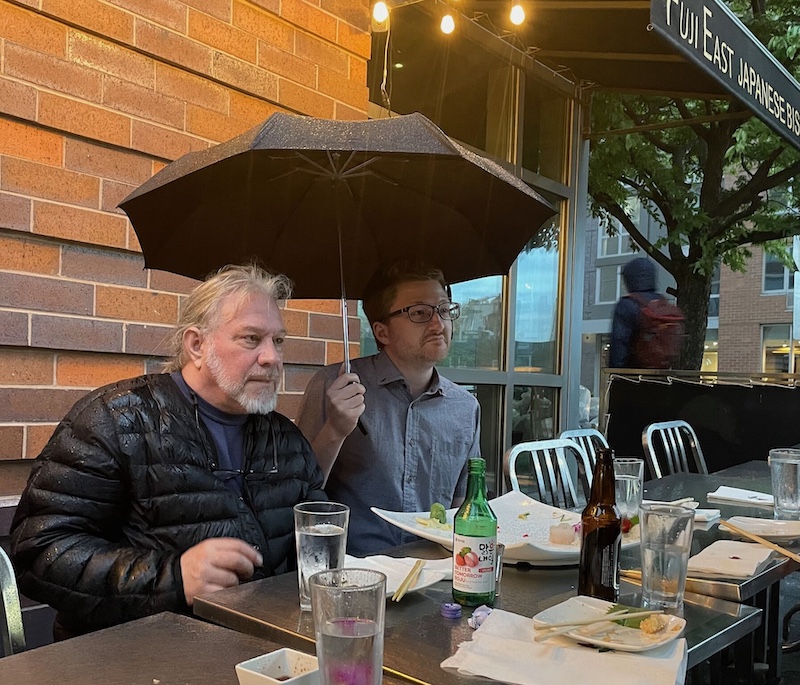 Bryce Merkl Sasaki and Paco Nathan aren't deterred by the rain at the Knowledge Graph Conference 2025
